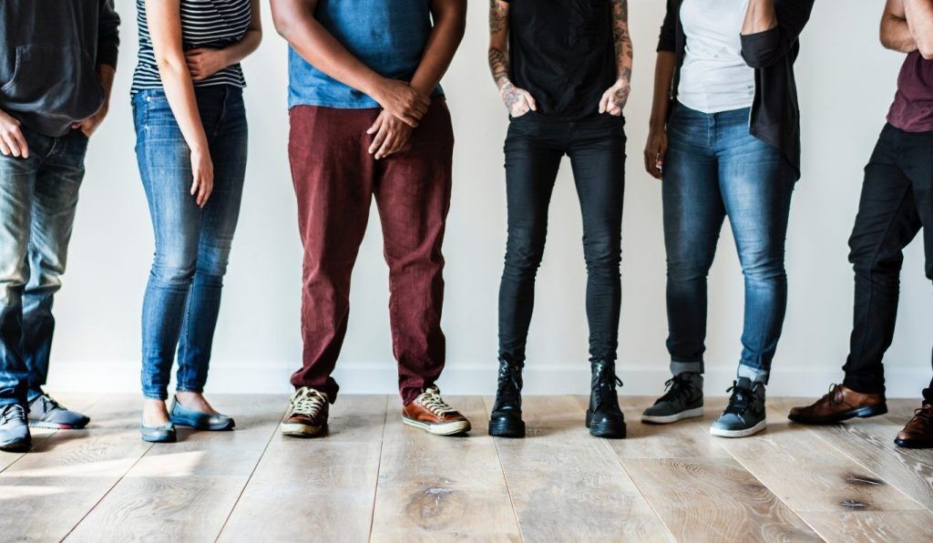 legs of team standing in a line